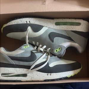 Nike Air Max Men’s Grey and Black Sneakers with Lime Accents fit a little snug.